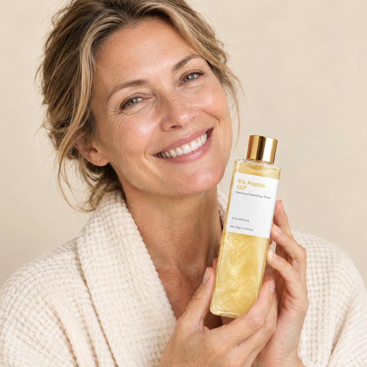 Woman holding the Stampira Silk Peptide EGF toner